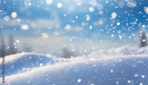 Winter snow background with snowdrifts, with beautiful light and snow flakes on the blue sky in the evening, banner format, copy space © fajrulisme