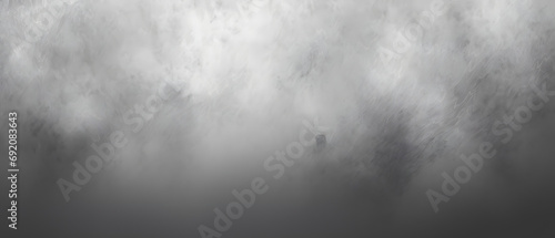 Amidst a swirling sea of fog and clouds, a solitary figure stands, embracing the mysterious beauty of the misty outdoors photo