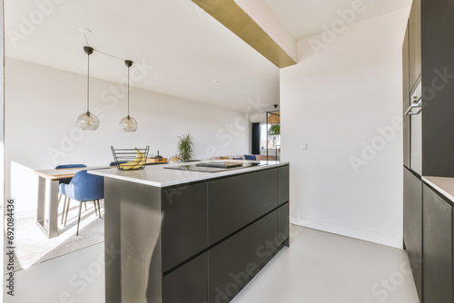 Kitchen and dining table in apartment photo
