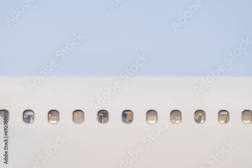 Row of Airplane Windows on Fuselage photo