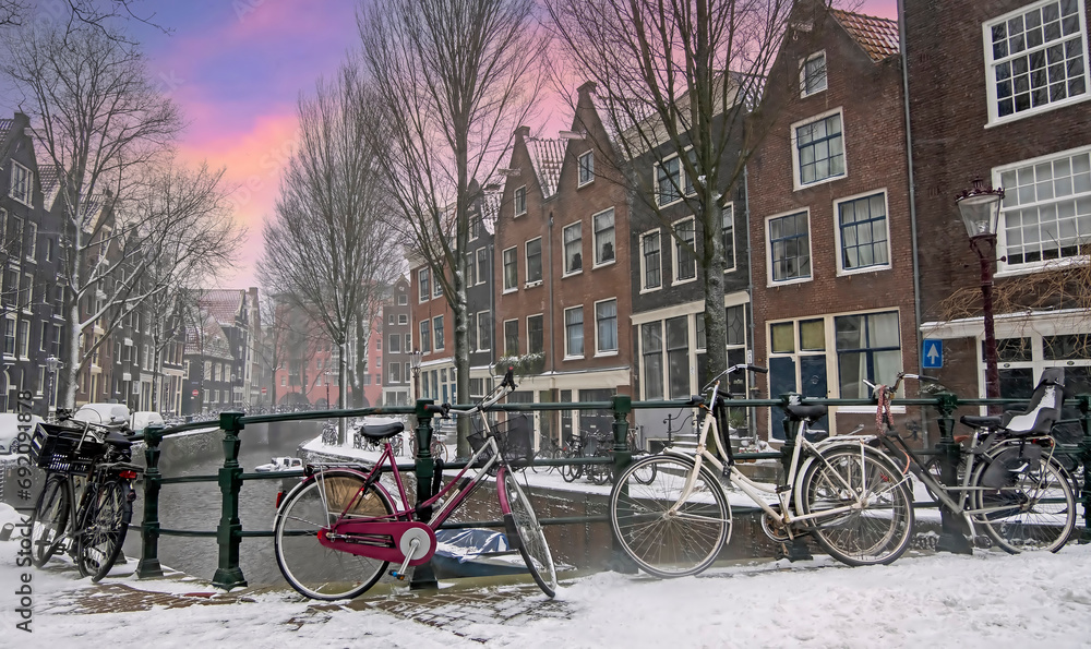 City scenic from snowy Amsterdam the Netherlands at sunset