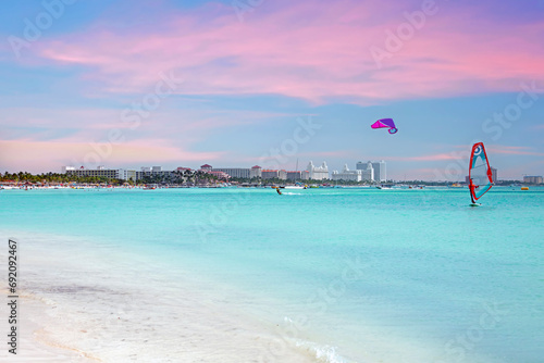 Watersports on the Caribbean Sea at Palm Beach at Aruba at sunset