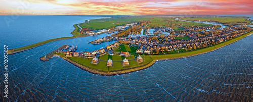 Aerial panorama from the historical town Stavoren at the IJsselmeer in the Netherlands at sunset photo