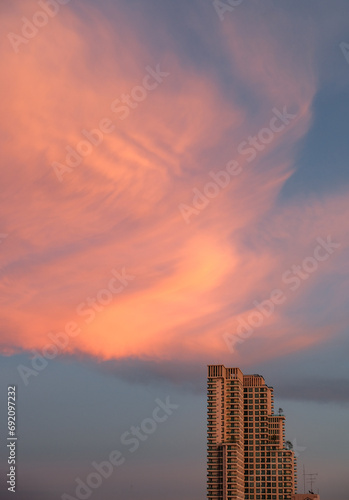 Skyscraper on evening cloudscape