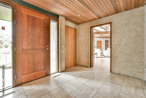 Entrance hall of house with three wooden doors photo