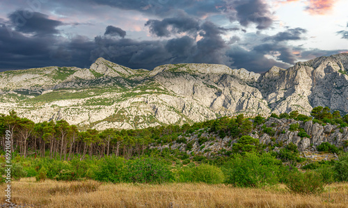 View of the rocky mountain and the contrasting cloudy sky. Croatia photo