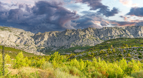 View of the rocky mountain and the contrasting cloudy sky. Croatia photo
