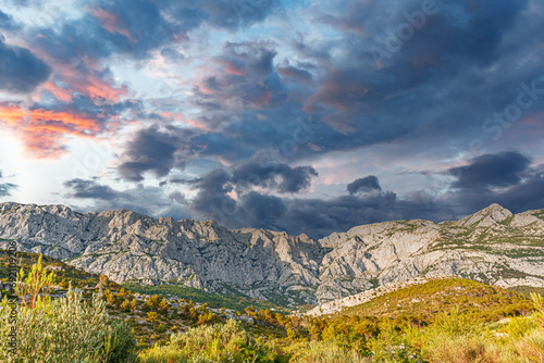 View of the rocky mountain and the contrasting cloudy sky. Croatia photo