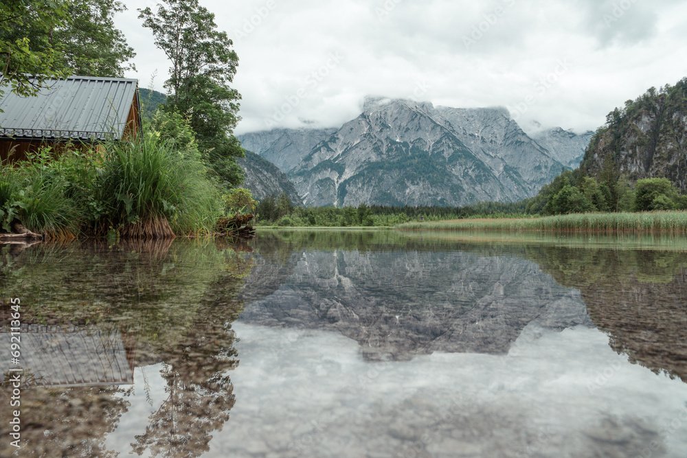 Fototapeta premium Lake reflection photo at Almsee lake in Austria.