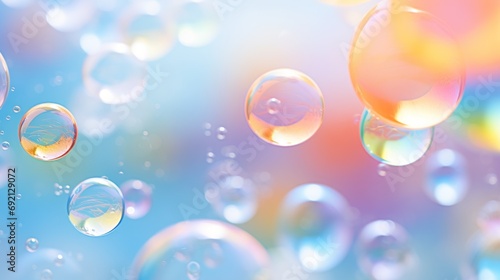  a group of bubbles floating on top of a blue and pink background with a rainbow hued sky in the background. photo