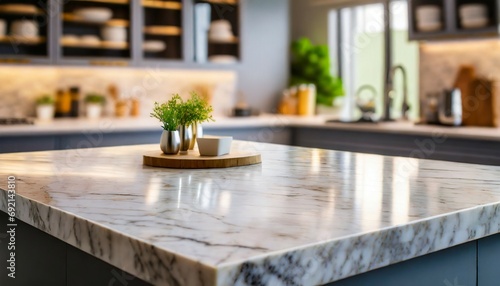 marble stone table top kitchen island on blur kitchen interior background