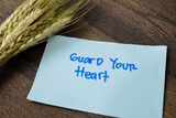 Concept of Guard Your Heart write on sticky notes isolated on white background.