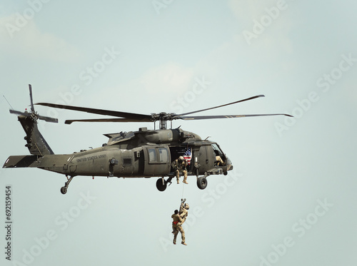 United States military helicopter. Combat US air force. Rescue mission exercise. photo