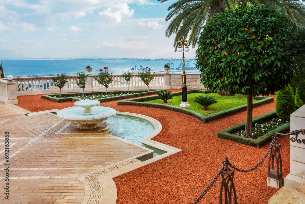 Amazing terrace of Bahai gardens in Haifa with tangerine tree