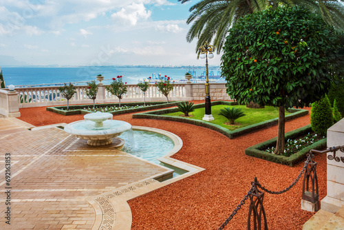 Amazing terrace of Bahai gardens in Haifa with tangerine tree © Marat Lala