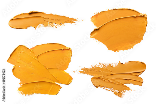 Orange oil paint strokes isolated on white, top view