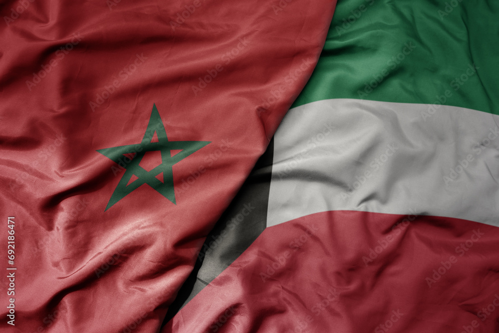 big waving national colorful flag of kuwait and national flag of morocco . big waving national colorful flag of kuwait and national flag of morocco .