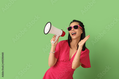 Young Asian woman with mega...