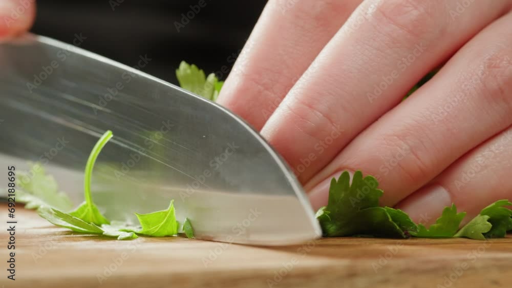 Cilantro parsley cutting by knife close up, chef chop cut coriander