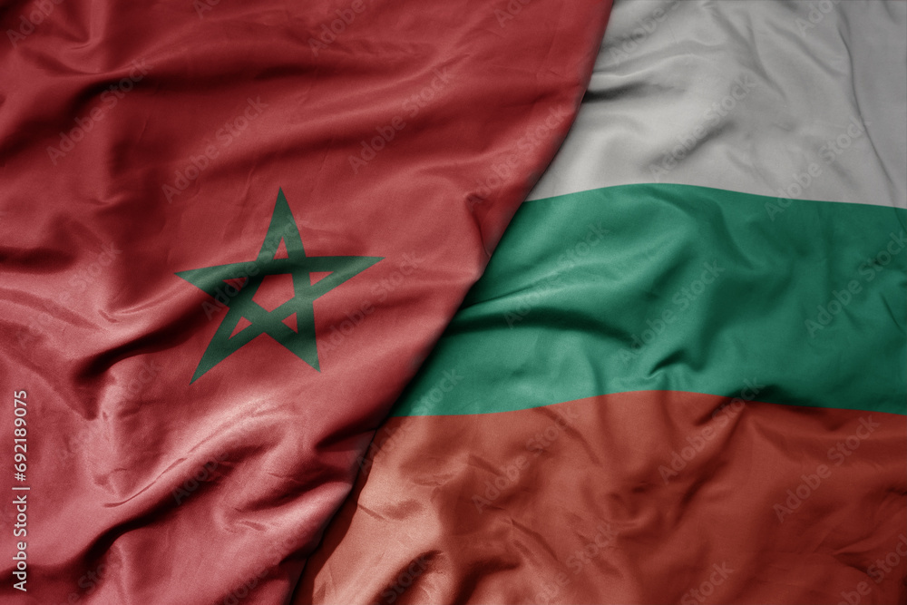 big waving national colorful flag of bulgaria and national flag of morocco . big waving national colorful flag of bulgaria and national flag of morocco .