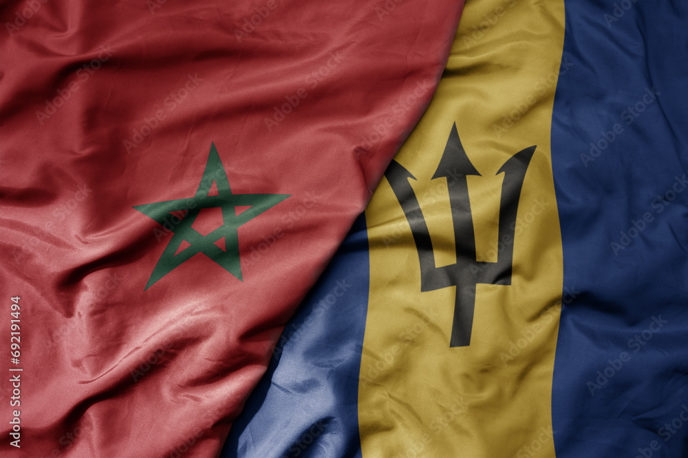 big waving national colorful flag of barbados and national flag of morocco . big waving national colorful flag of barbados and national flag of morocco .
