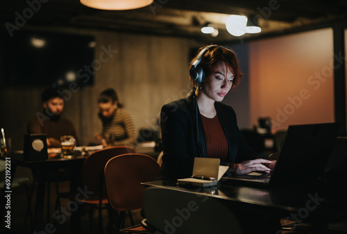 Business person analyzing sales statistics and planning marketing strategy for profit growth in corporate office. Working late  coordinating for market expansion.