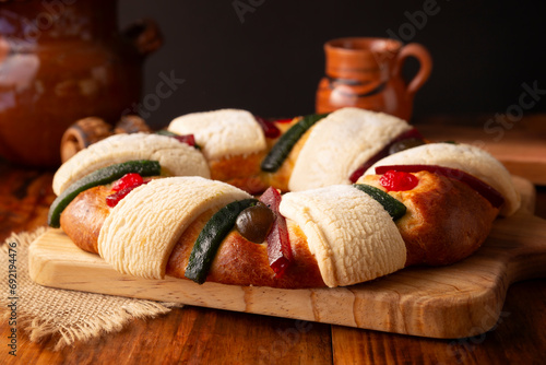 Three Kings Bread also called Rosca de Reyes, Roscon, Epiphany Cake, traditionally served with hot chocolate in a clay Jarrito. Mexican tradition on January 5th.