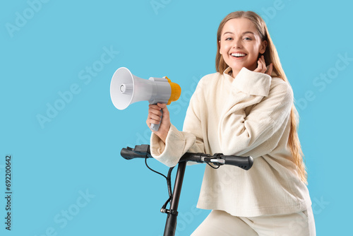 Young woman with megaphone ...