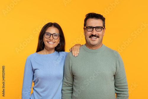 European retired glad woman and man with glasses, standing shoulder to shoulder © Prostock-studio