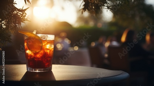 Close-up of a refreshing summer cocktail, blurred background of a sunset terrace