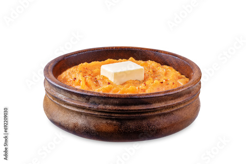 Cooked sweet potato puree in a bowl on a white isolated background photo