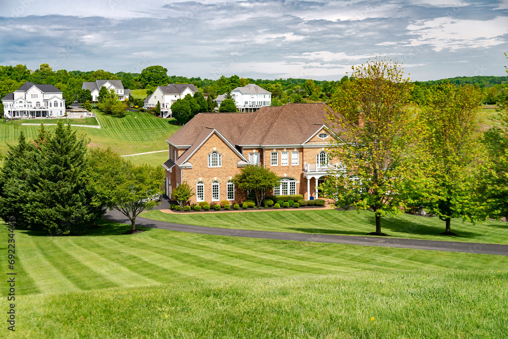 Luxury brick House in suburb in North America. Luxury houses with nice landscapes. Luxury brick House in suburb in North America. Luxury houses with nice landscapes.