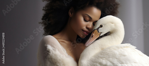 Female portrait. Beautiful young curly black childfree brunette woman hugs white swan on gray background. Concept of caring for pet, bird, forest animal, tenderness, love, friendship. Generative AI photo