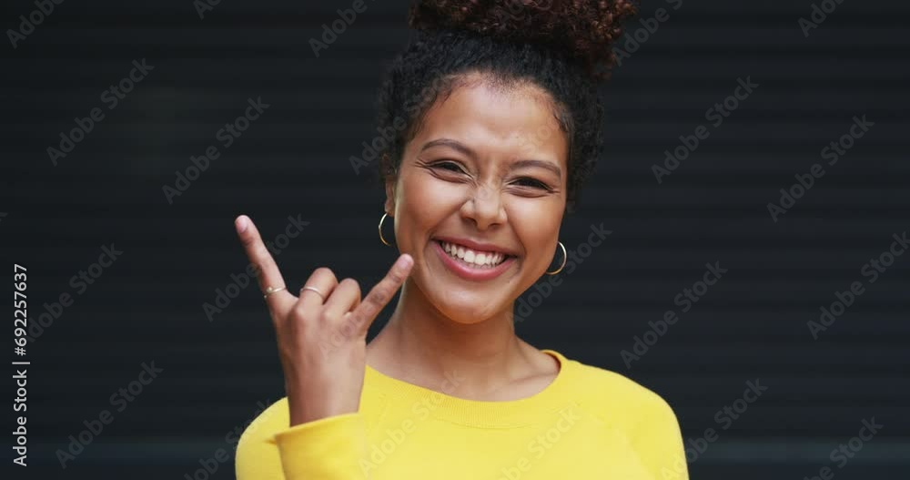 Face, rock on and woman with a smile, excited and freedom with support, culture and hand gesture. Portrait, person and model with sign, good mood and vibes with energy, rockstar and emoji with icon Face, rock on and woman with a smile, excited and freedom with support, culture and hand gesture. Portrait, person and model with sign, good mood and vibes with energy, rockstar and emoji with icon