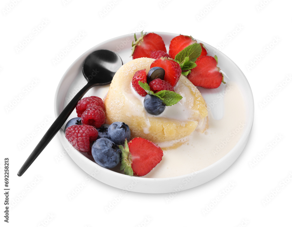 Delicious vanilla fondant with fresh berries isolated on white Delicious vanilla fondant with fresh berries isolated on white
