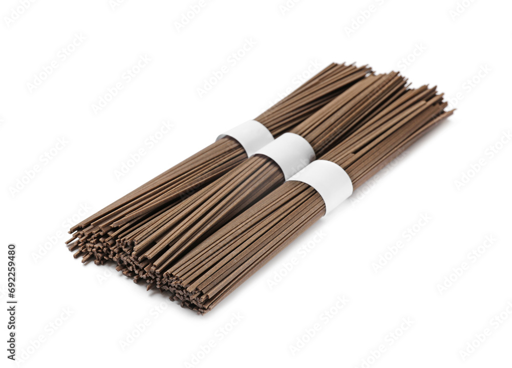 Uncooked buckwheat noodles (soba) isolated on white Uncooked buckwheat noodles (soba) isolated on white