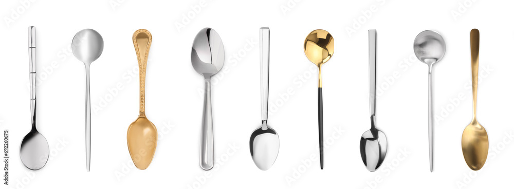 Stylish golden and silver spoons on white background - obrazy, fototapety, plakaty 