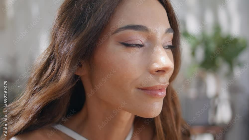 Gorgeous woman face looking camera with gentle smile at sunlight terrace closeup Gorgeous woman face looking camera with gentle smile at sunlight terrace closeup