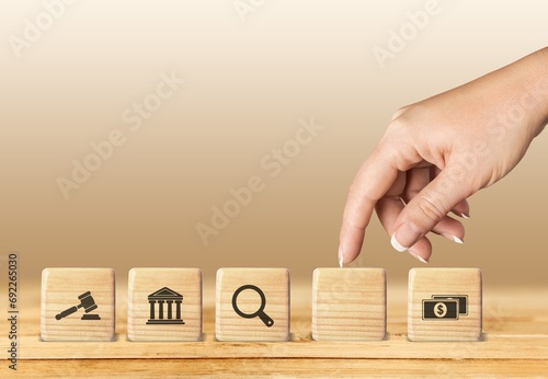 regulations and compliance financial icons on wooden cubes photo