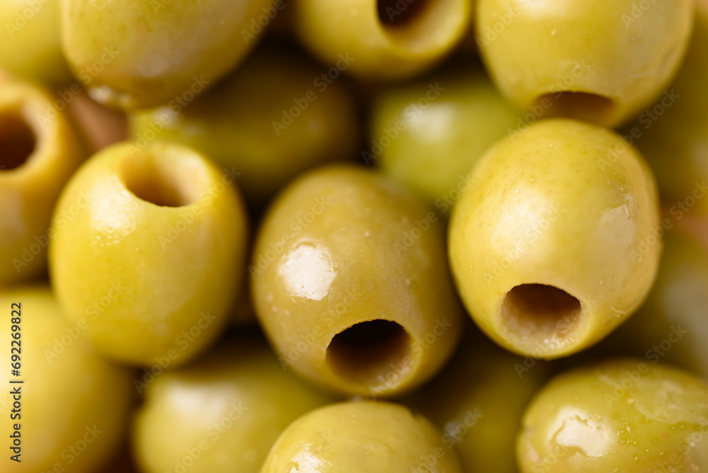 Pickled olives, Pitted green olives texture background Pickled olives, Pitted green olives texture background