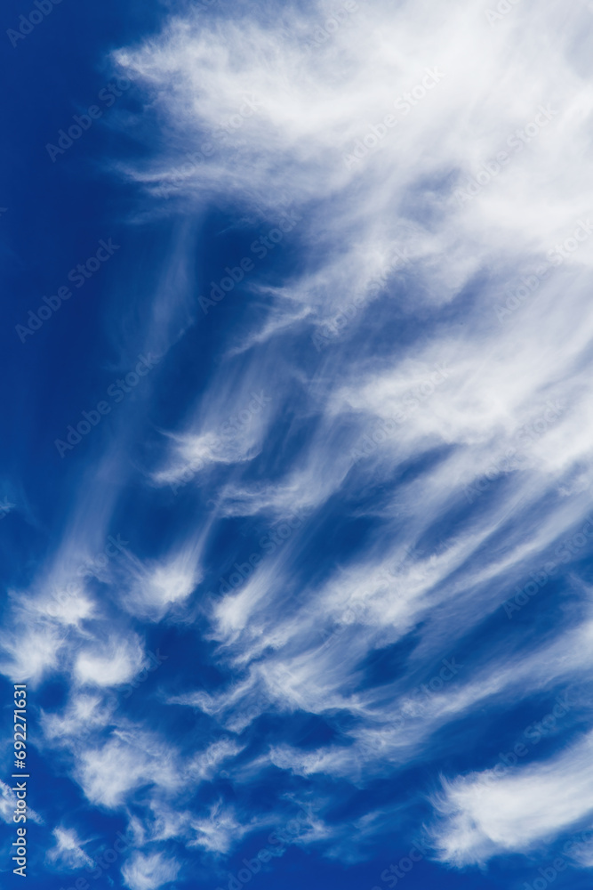 White Cirrus Clouds In A Blue Sky Smeared By Winds