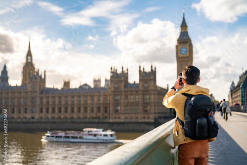 Photography Unrecognizable young happy Latin man tourist wearing sunglasses and casual outfi