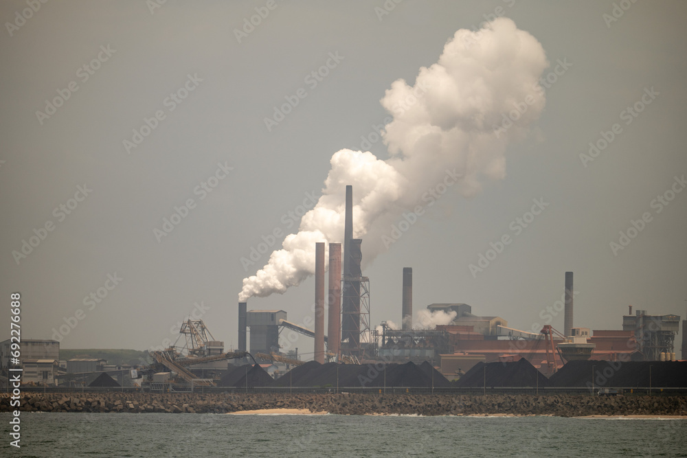 Industrial Factories Producing Pollution by the Ocean