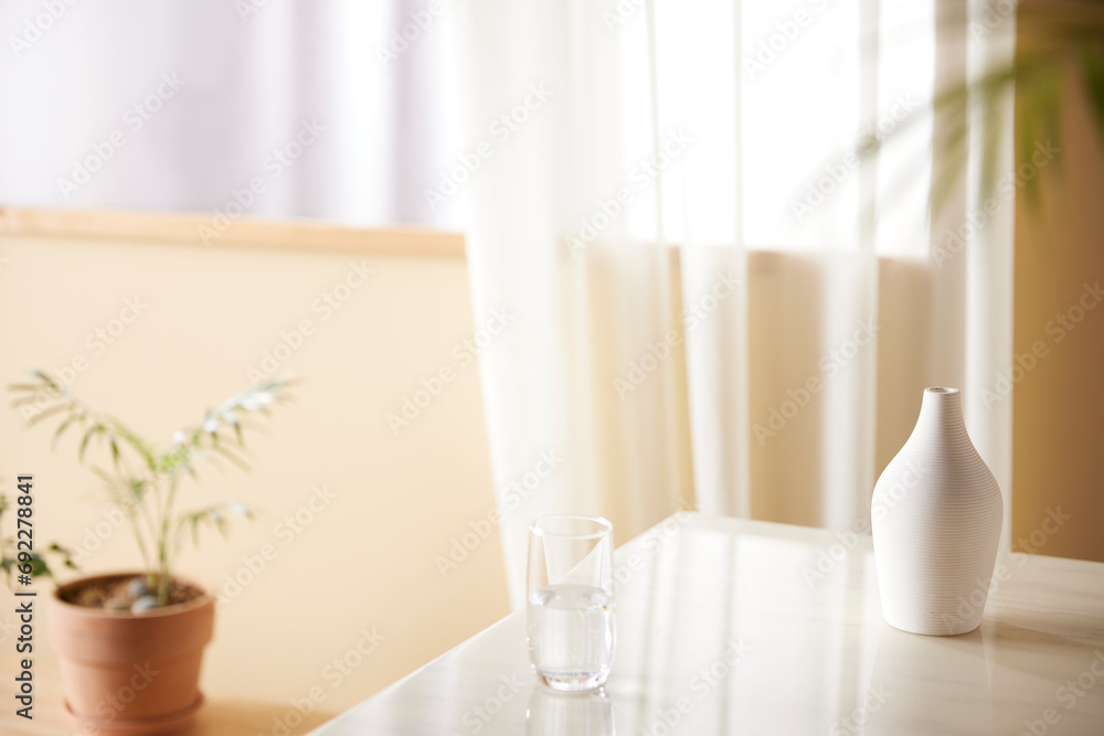 A cozy, bright room with sunlight streaming in. A cozy, bright room with sunlight streaming in.