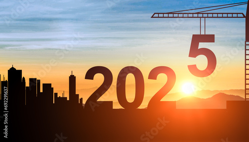 2025. New Year 2025. silhouette crane prepare to welcome 2025 new year. Construction crane sets numbers for Happy New Year 2025. New Start motivation photo
