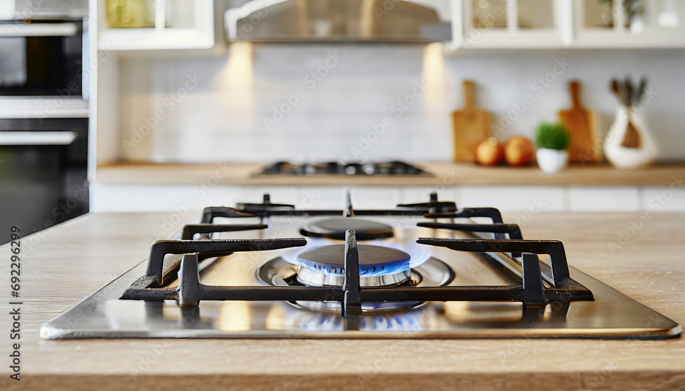 gas stove with flame in modern kitchen