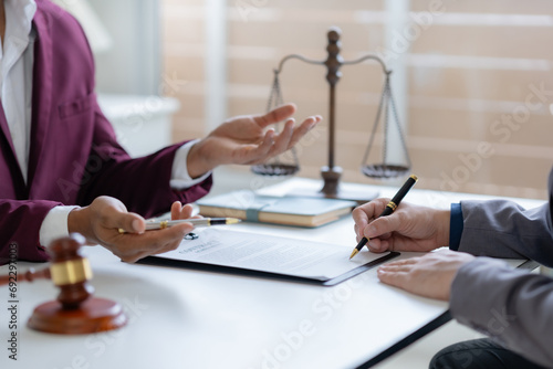 Treaty of the law. Sign a contract business. Legal execution department makes an appointment with the customer to sign a mediation agreement to pay the debt. Lawyer discuss the contract document.