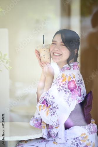 Japanese woman in yukata in coffee shop