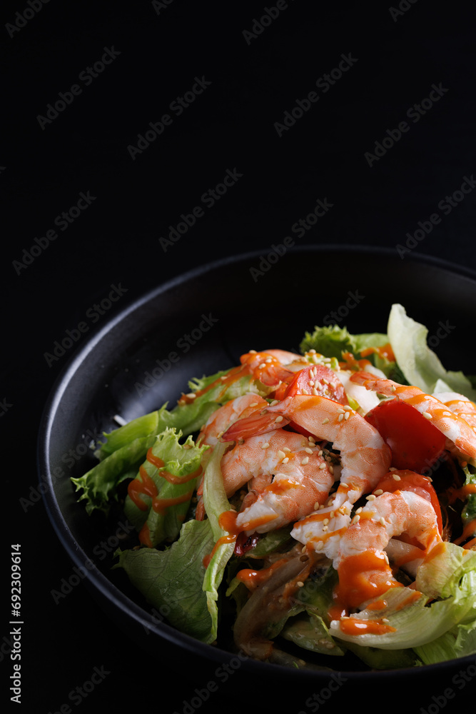 Japanese salad isolated in black background Japanese salad isolated in black background