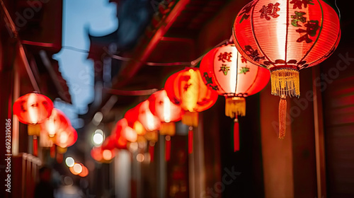 A close-up of a street with many red lanterns hanging from it festive ambiance of a street decorated with red lanterns cultural festivals  holiday promotions  and travel.chinese lanterns in the temple